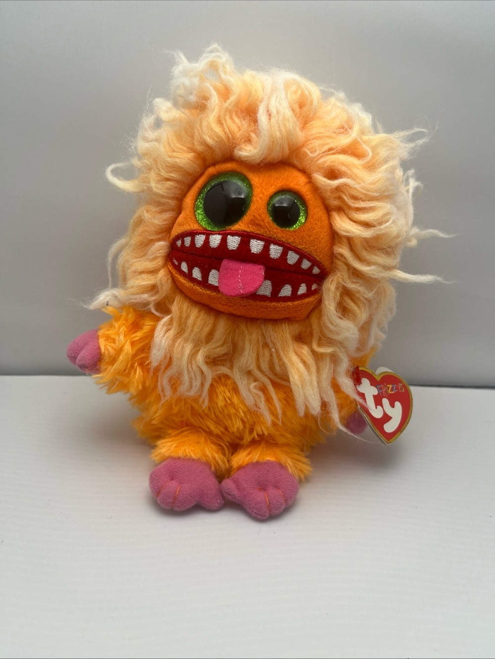 Ty Orange Fuzzle Monster Plush with Pink Accents and Green Glitter Eyes